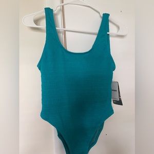 Teal one piece swimsuit. It’s too small for me.